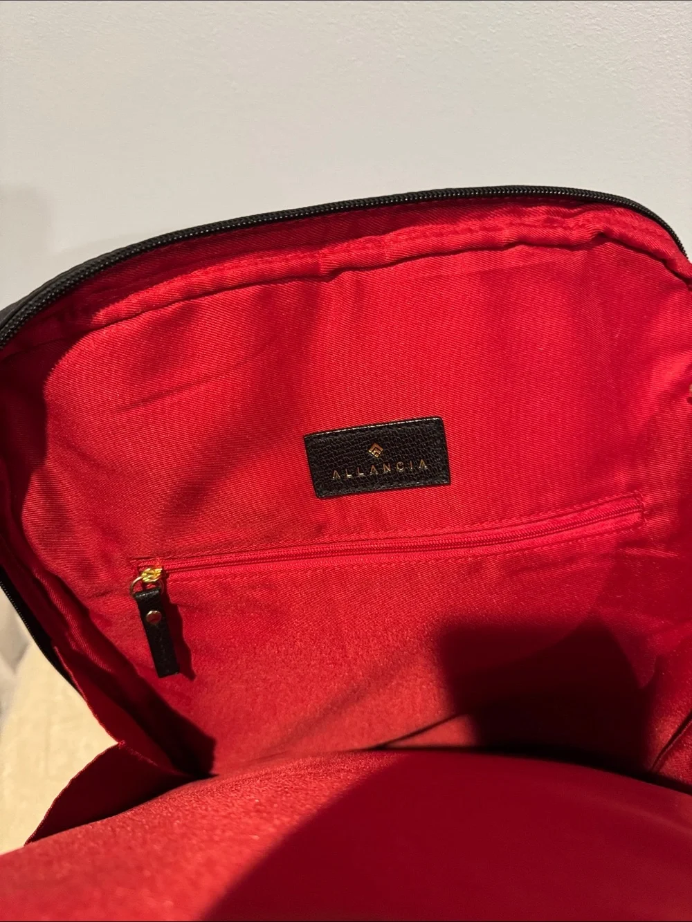Allancia Peyton black nylon backpack featuring striking gold-tone hardware. NEW